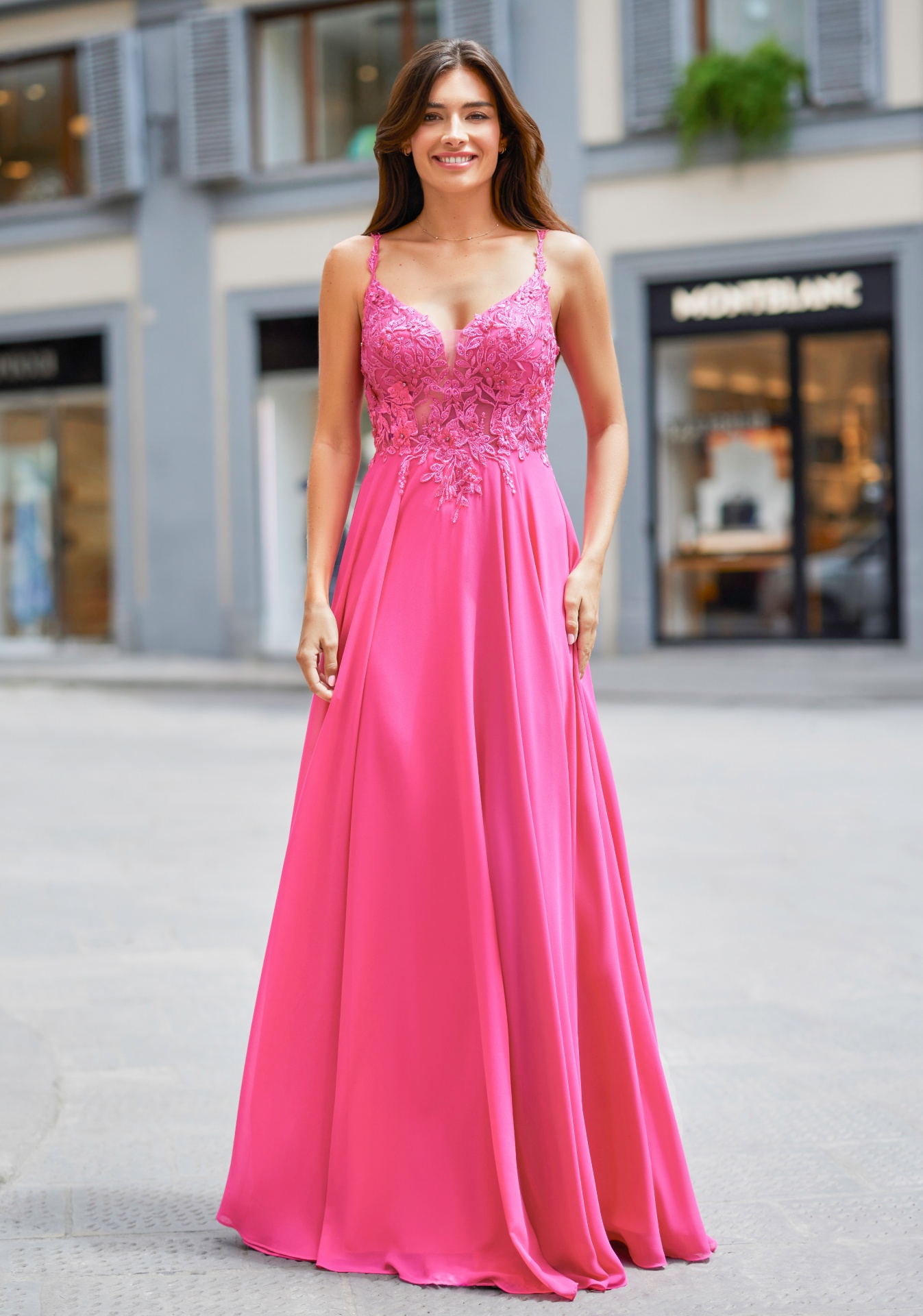 Woman wearing Style 0972 Shocking Pink evening dress