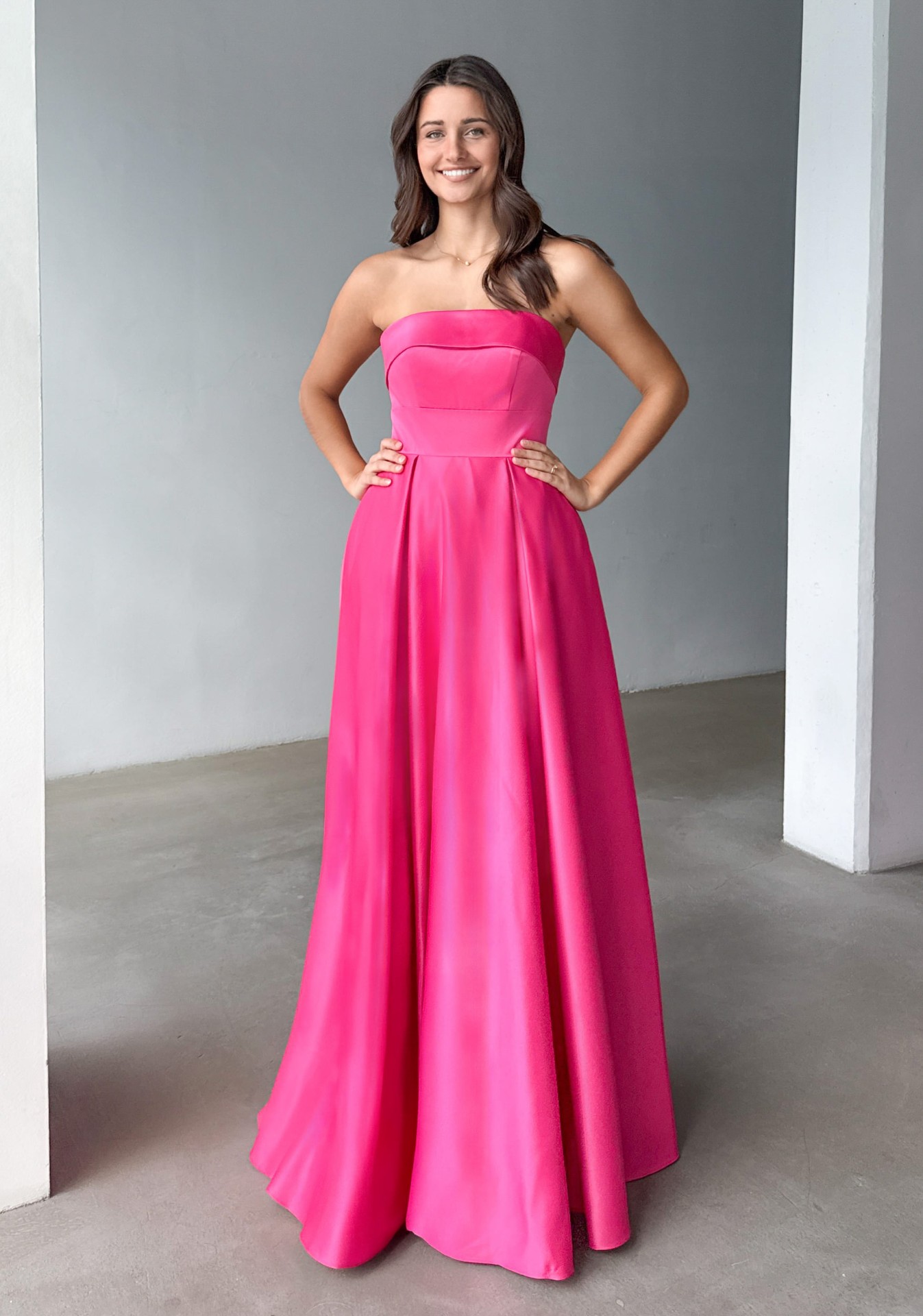 Woman wearing Style 1262 Cosmos Pink evening dress